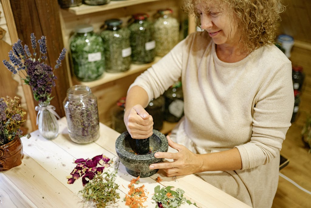 15 Essential Medicinal Herbs to Grow in Your Garden: A Complete Guide 2 essential medicinal herbs being pounded in mortar